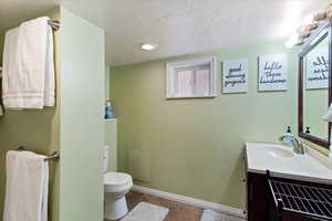 Bathroom featuring vanity, and bath shower combination