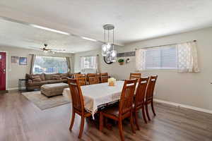 Dining space featuring LVP floors, and a ceiling fan