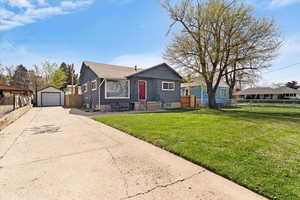 Bungalow-style home featuring a detached garage.