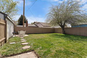 Fenced backyard featuring a patio area