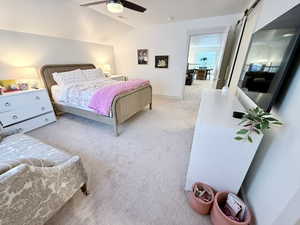 3rd bedroom upstairs featuring a barn door to the full bathroom