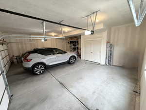 3 Car Garage with storage space and electric vehicle charger