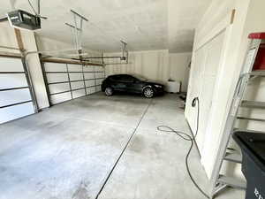 3 Car Garage with storage space and electric vehicle charger