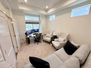 Office/Parlor featuring a raised ceiling, light carpet, and recessed lighting