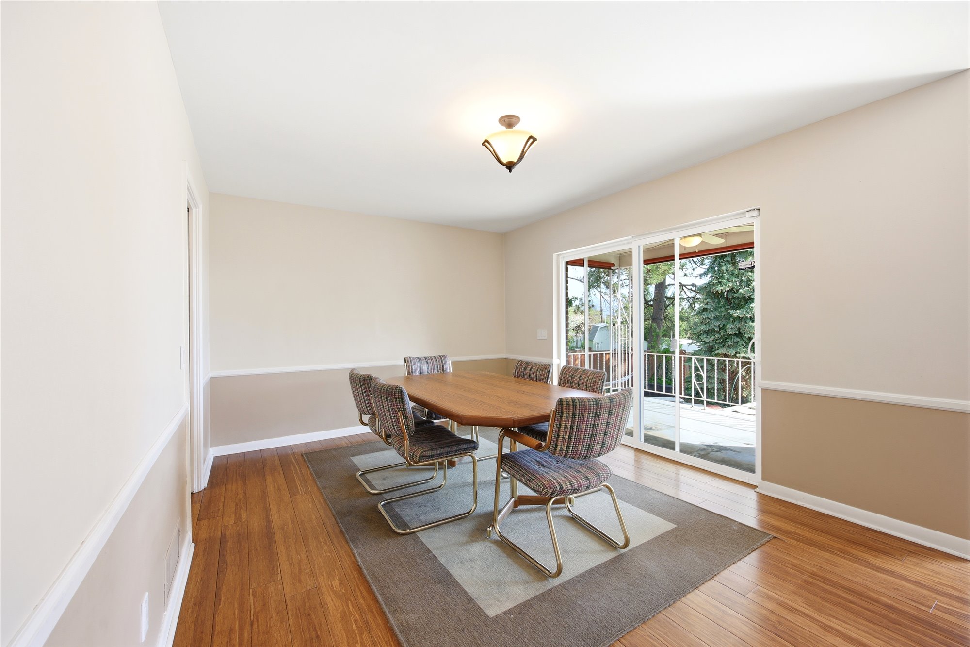 Dining space featuring light wood-style flooring and baseboards