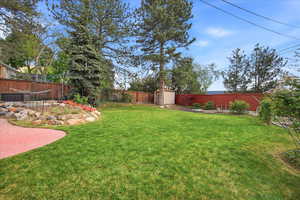 Fenced backyard with a storage unit