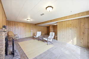 Sitting room with wood walls