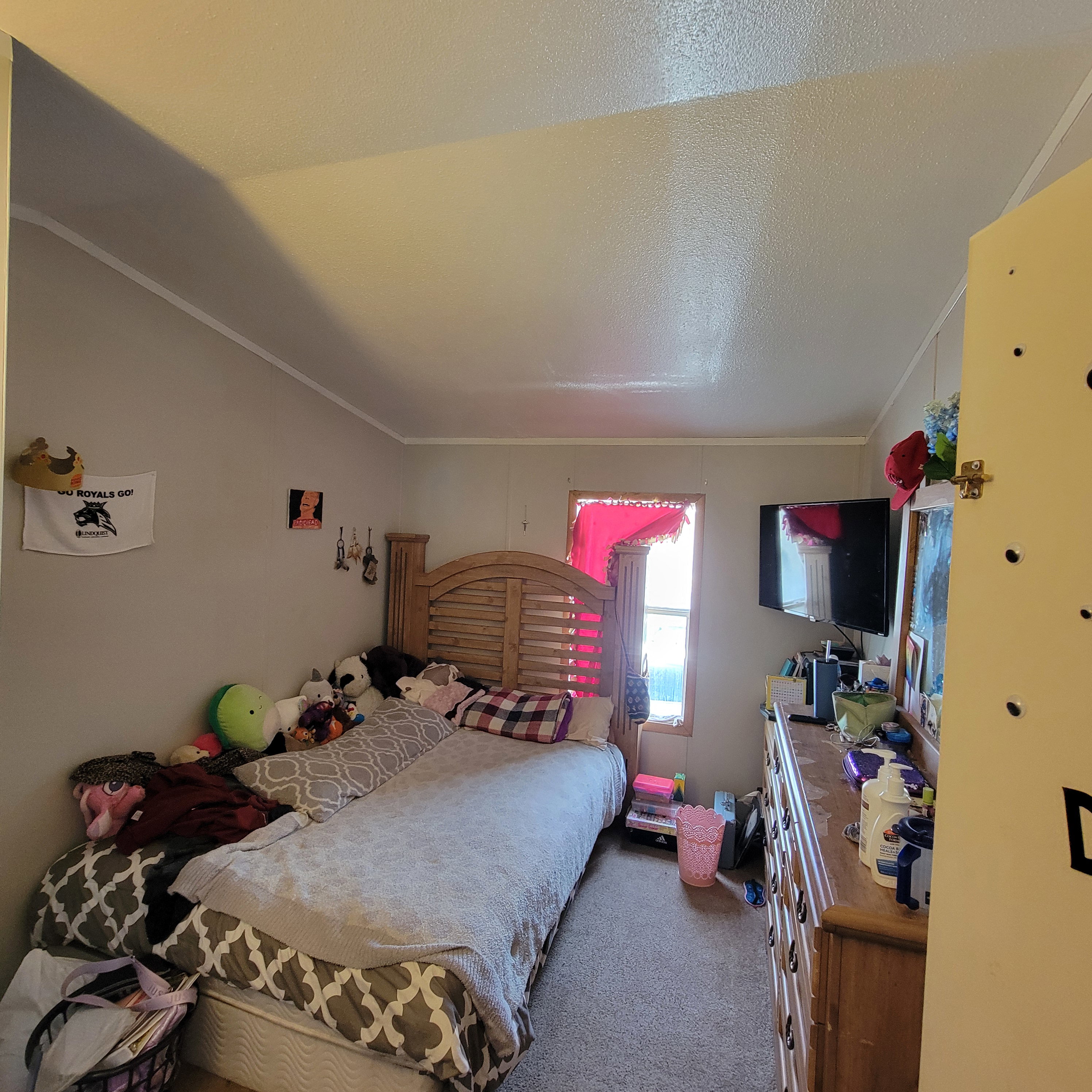 Bedroom featuring carpet and ornamental molding