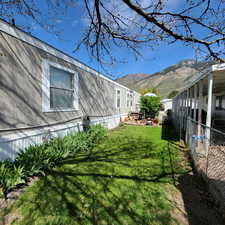 Fenced yard featuring a mountain view
