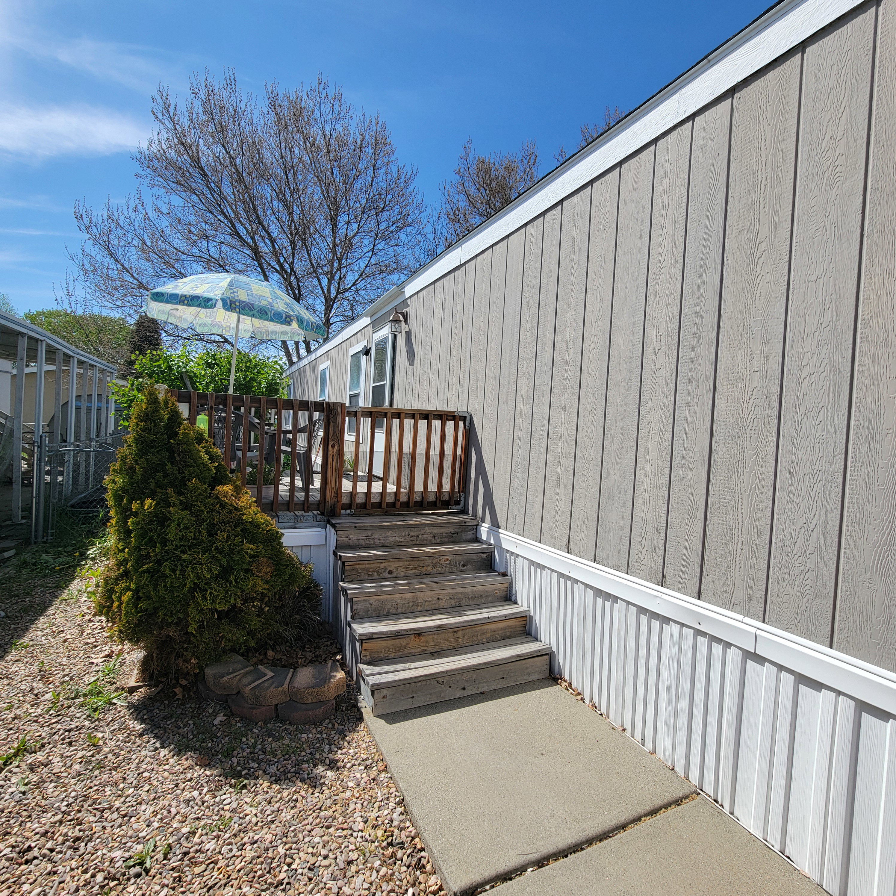 View of exterior entry featuring a deck