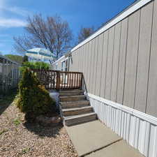 View of exterior entry featuring a deck