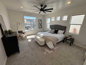 Bedroom with recessed lighting, a ceiling fan, and carpet