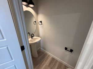 Bathroom with baseboards and light wood-style floors