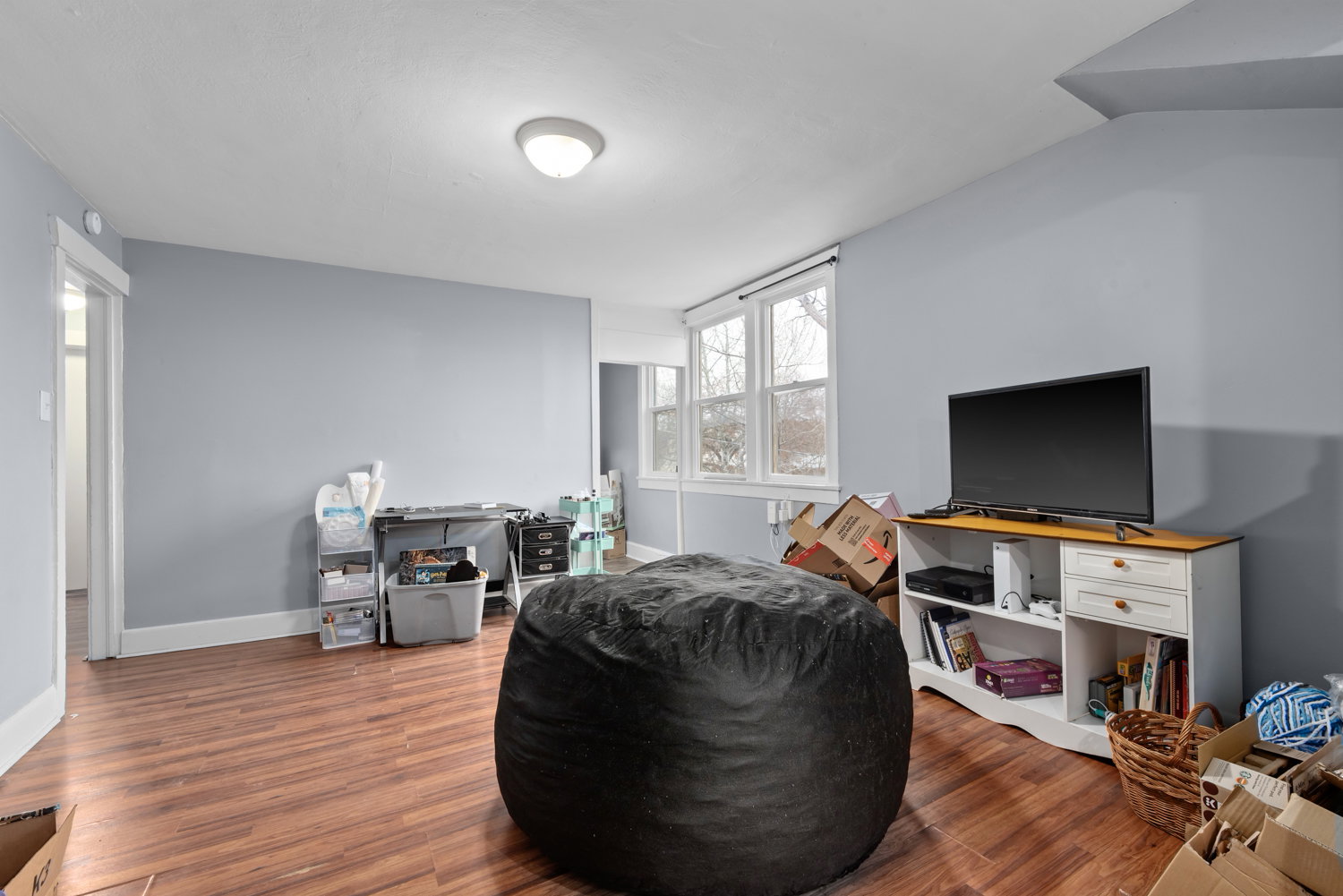 Sitting room featuring wood finished floors and baseboards