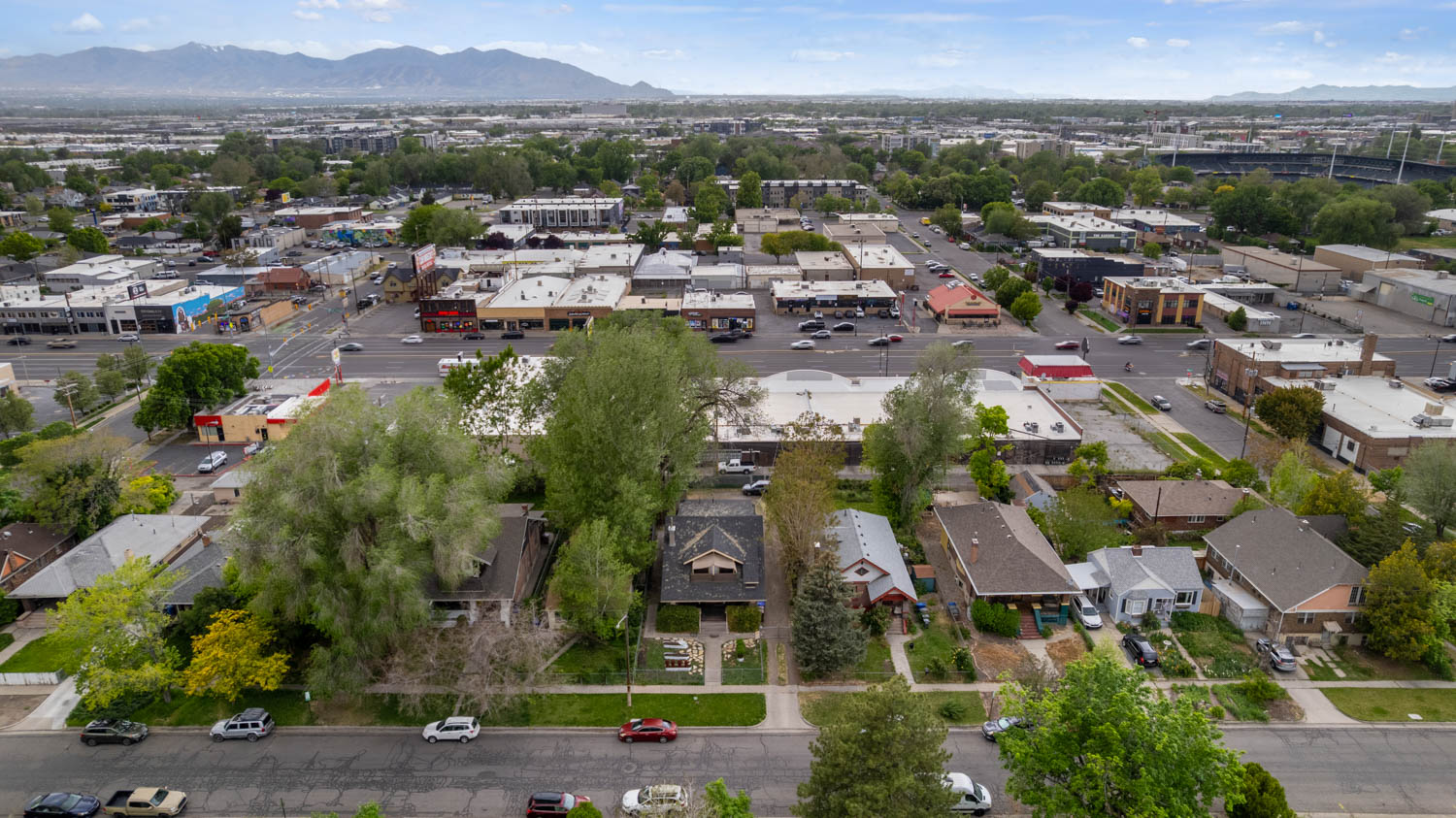 Aerial perspective showcasing an urban neighborhood with residential and commercial properties