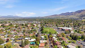 Aerial view of residential area featuring mountains