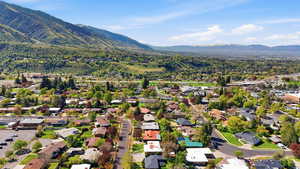 Aerial view of residential area featuring a mountainous background