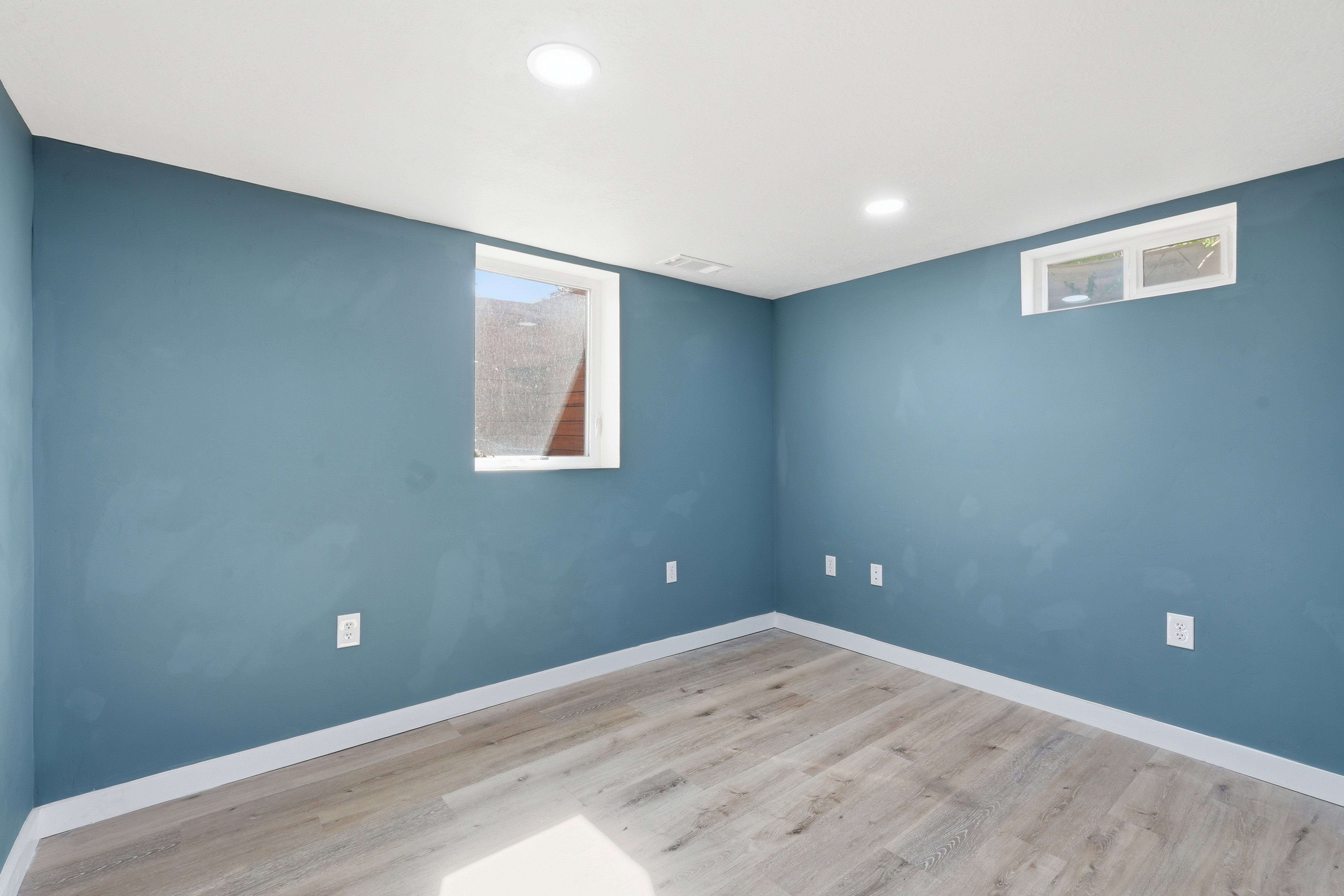 Unfurnished room with light wood finished floors and recessed lighting