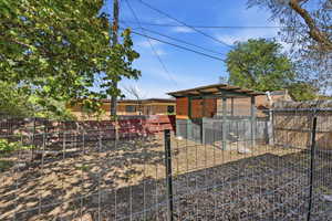 View of yard featuring an outdoor structure and exterior structure