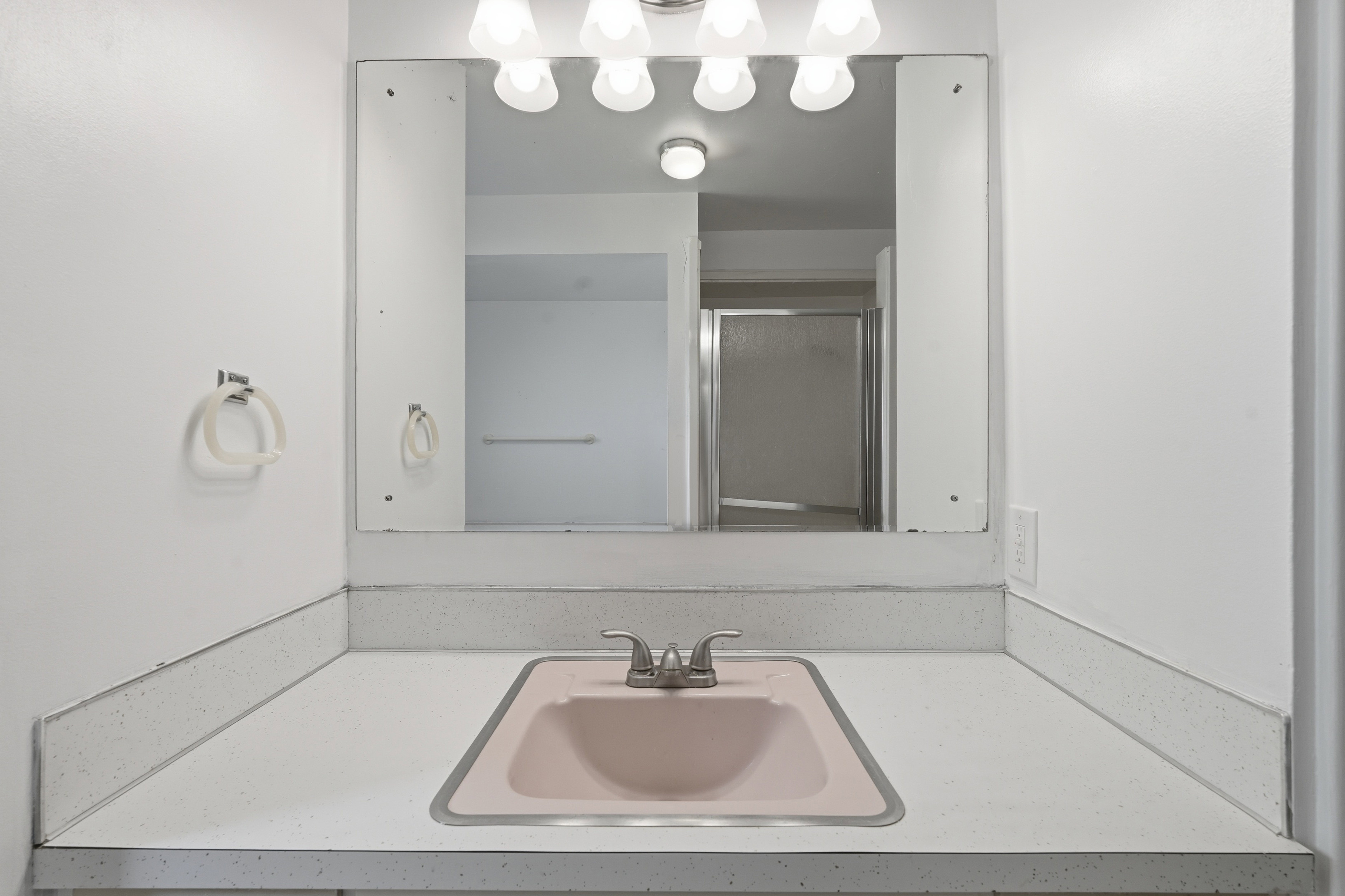 Bathroom featuring vanity and a stall shower