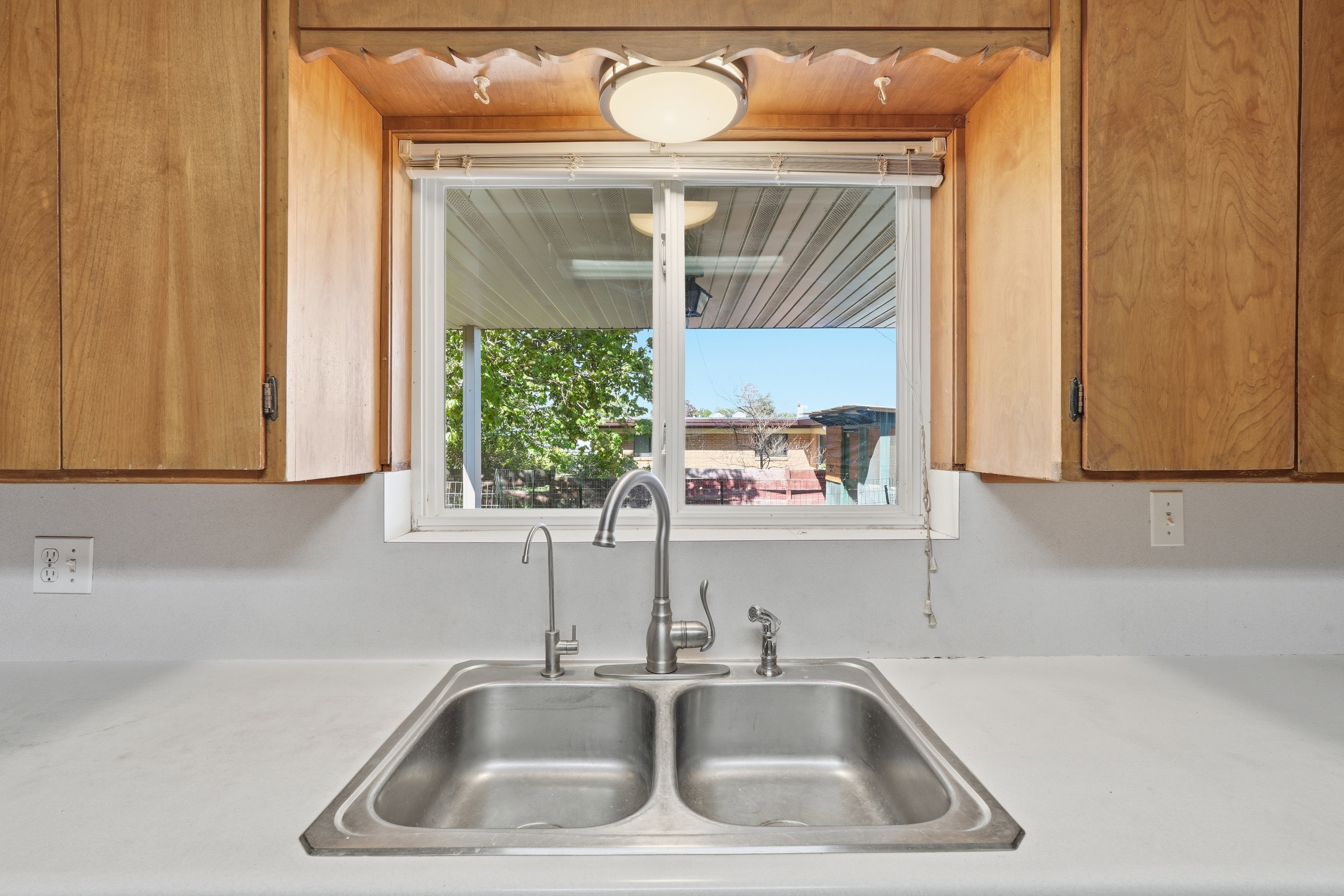 Kitchen featuring light countertops
