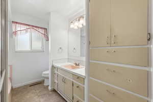 Full bathroom featuring vanity and light tile patterned floors