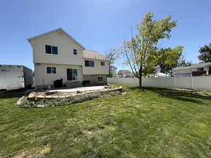 Rear view of property with a patio area