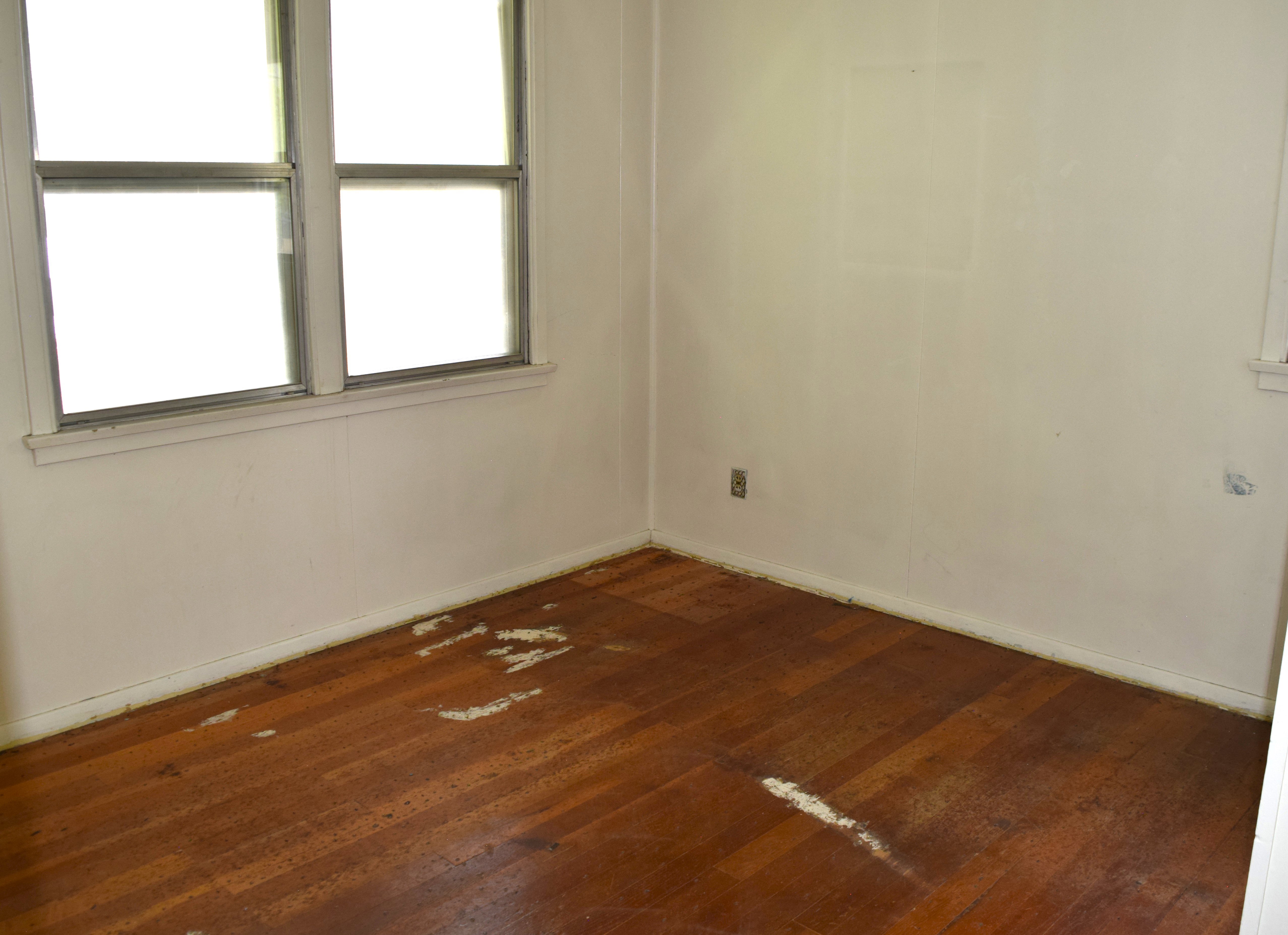 Empty room featuring dark wood finished floors