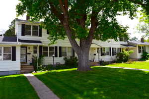 View of front of property featuring a front yard