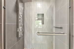 Full bathroom featuring a shower stall