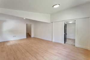 Empty room featuring light wood-type flooring