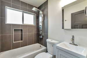 Bathroom featuring vanity and shower / washtub combination