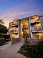 View of front of house featuring a balcony