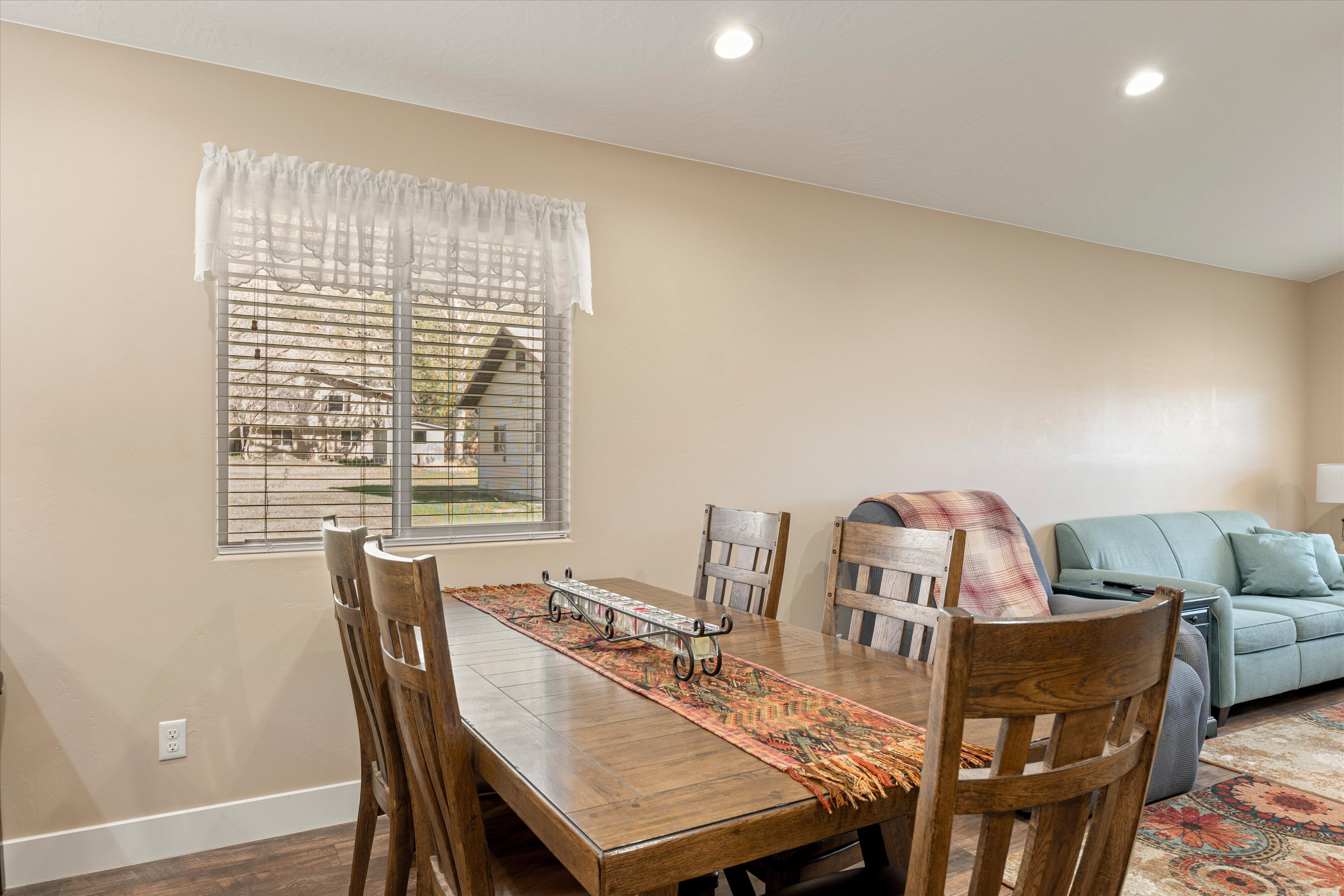 Dining area featuring wood finished floors and recessed lighting