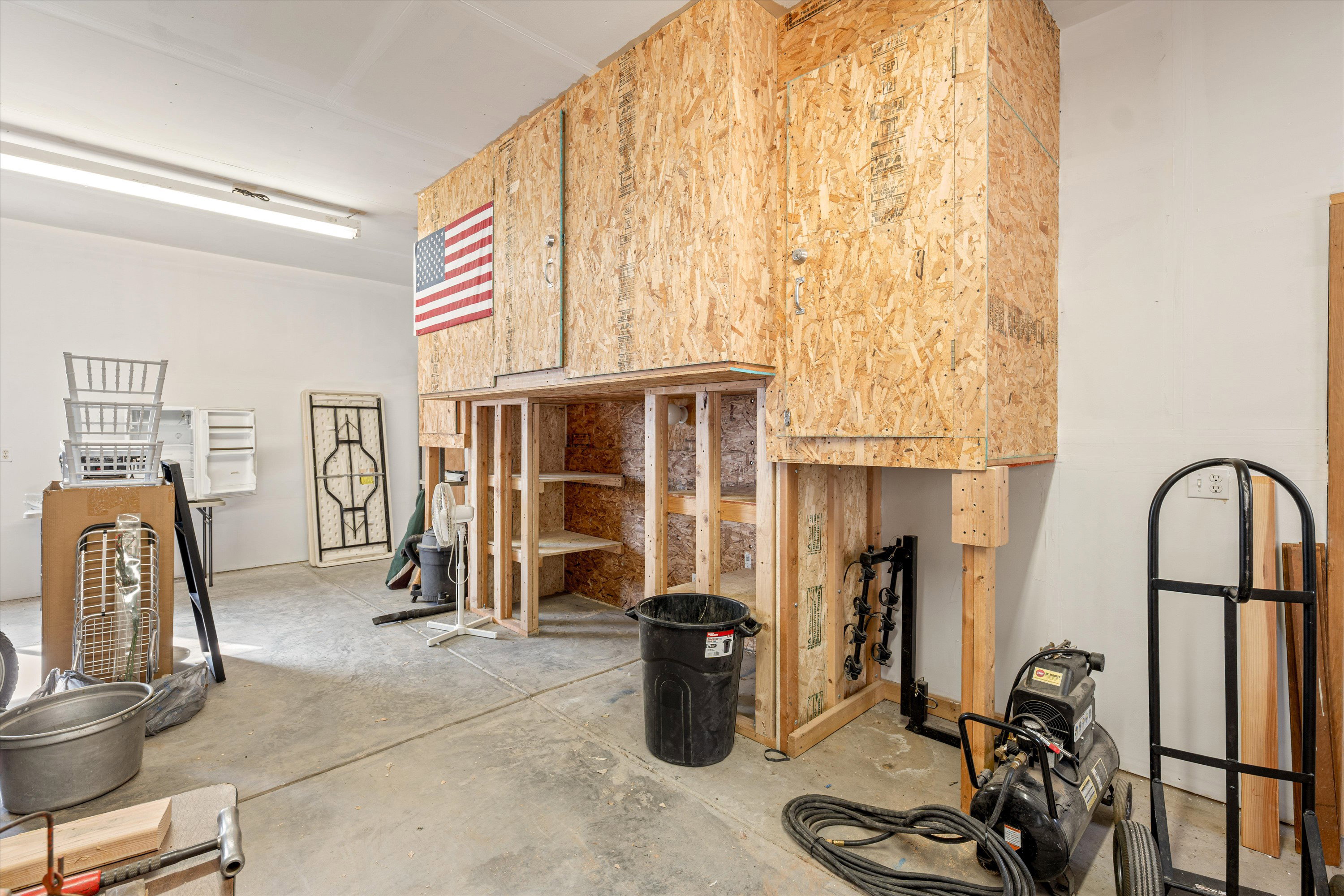 Misc room featuring unfinished concrete floors