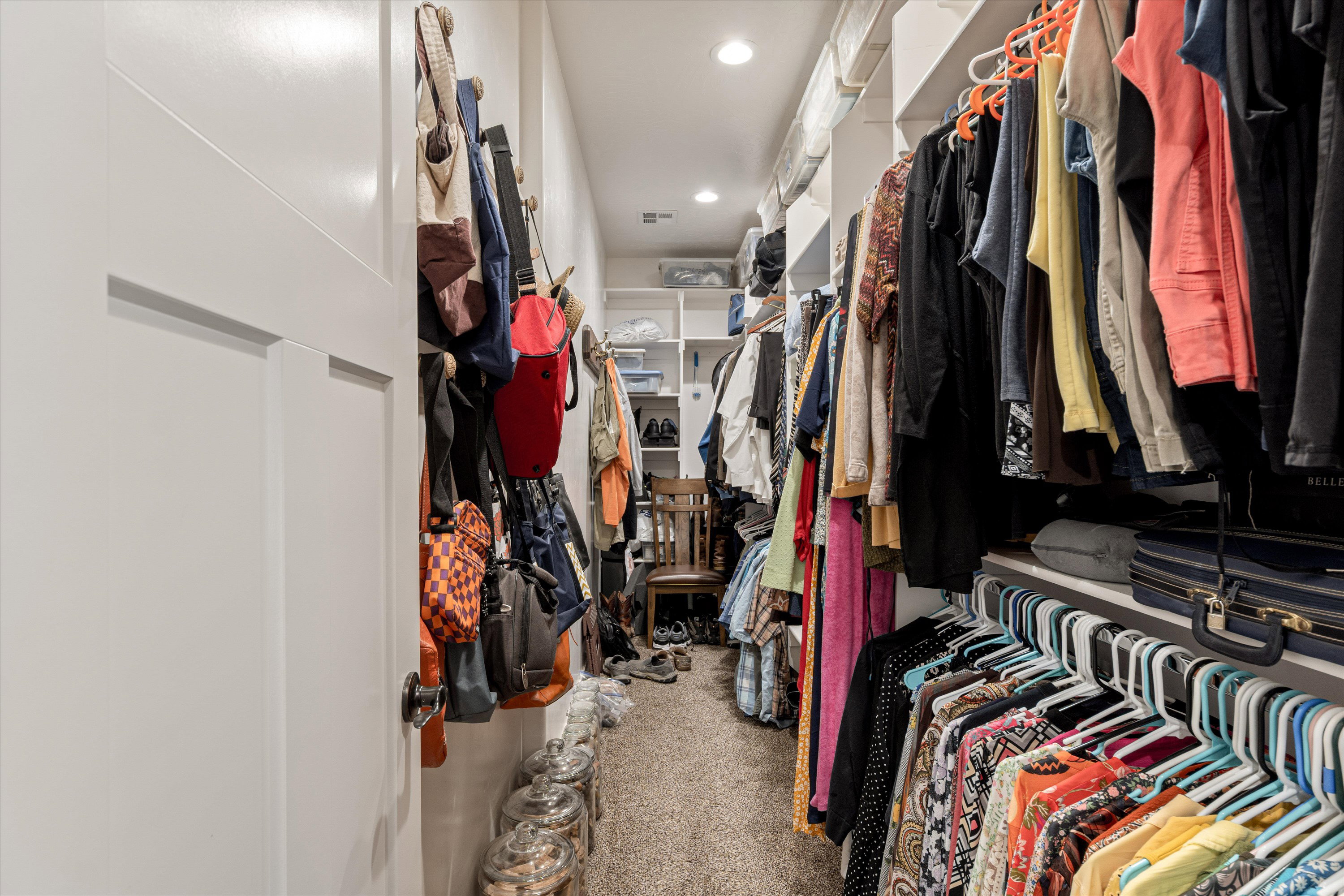 Walk in closet with carpet flooring