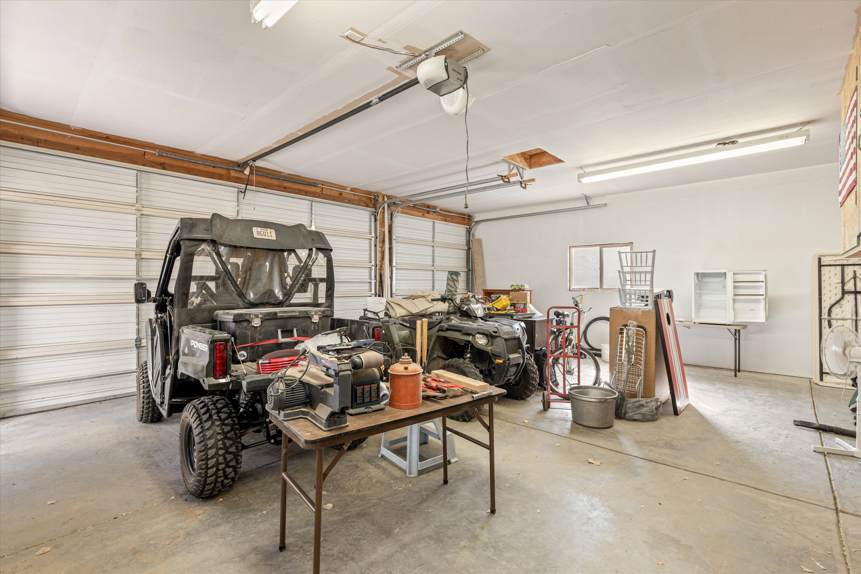 Garage featuring a garage door opener