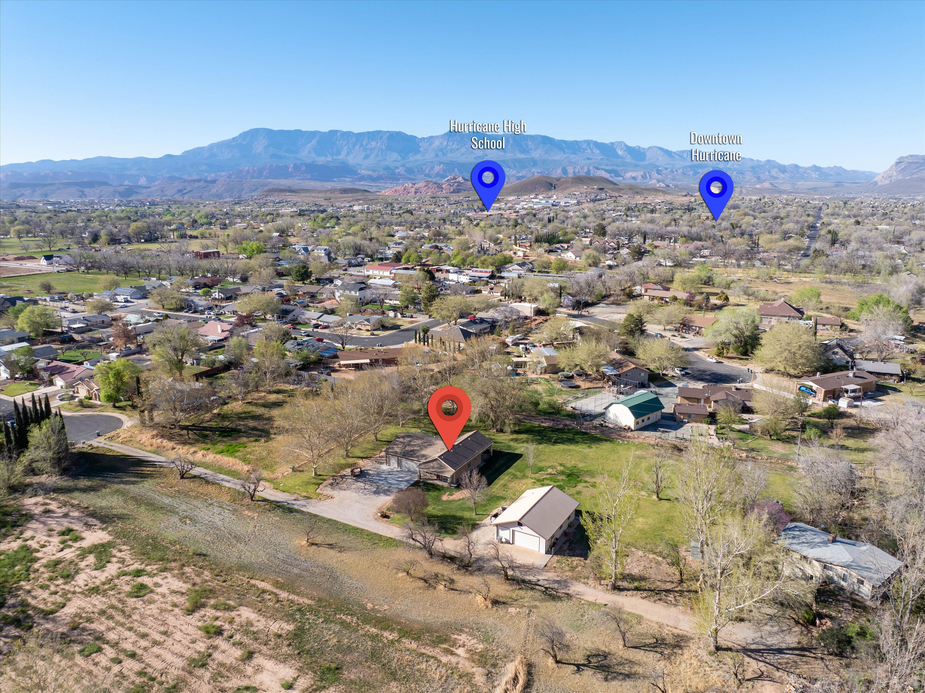 Aerial perspective of suburban area with a mountain backdrop