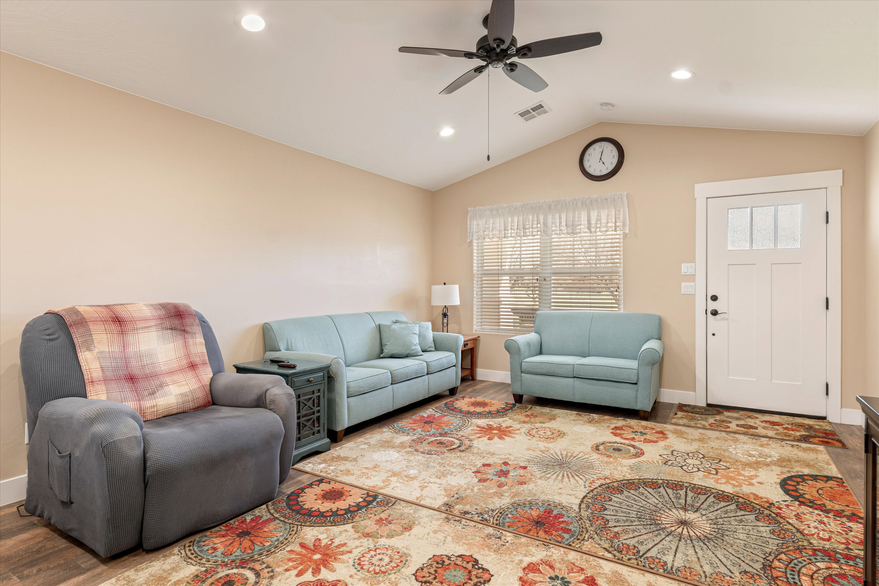 Living room featuring recessed lighting, a ceiling fan, and wood finished floors