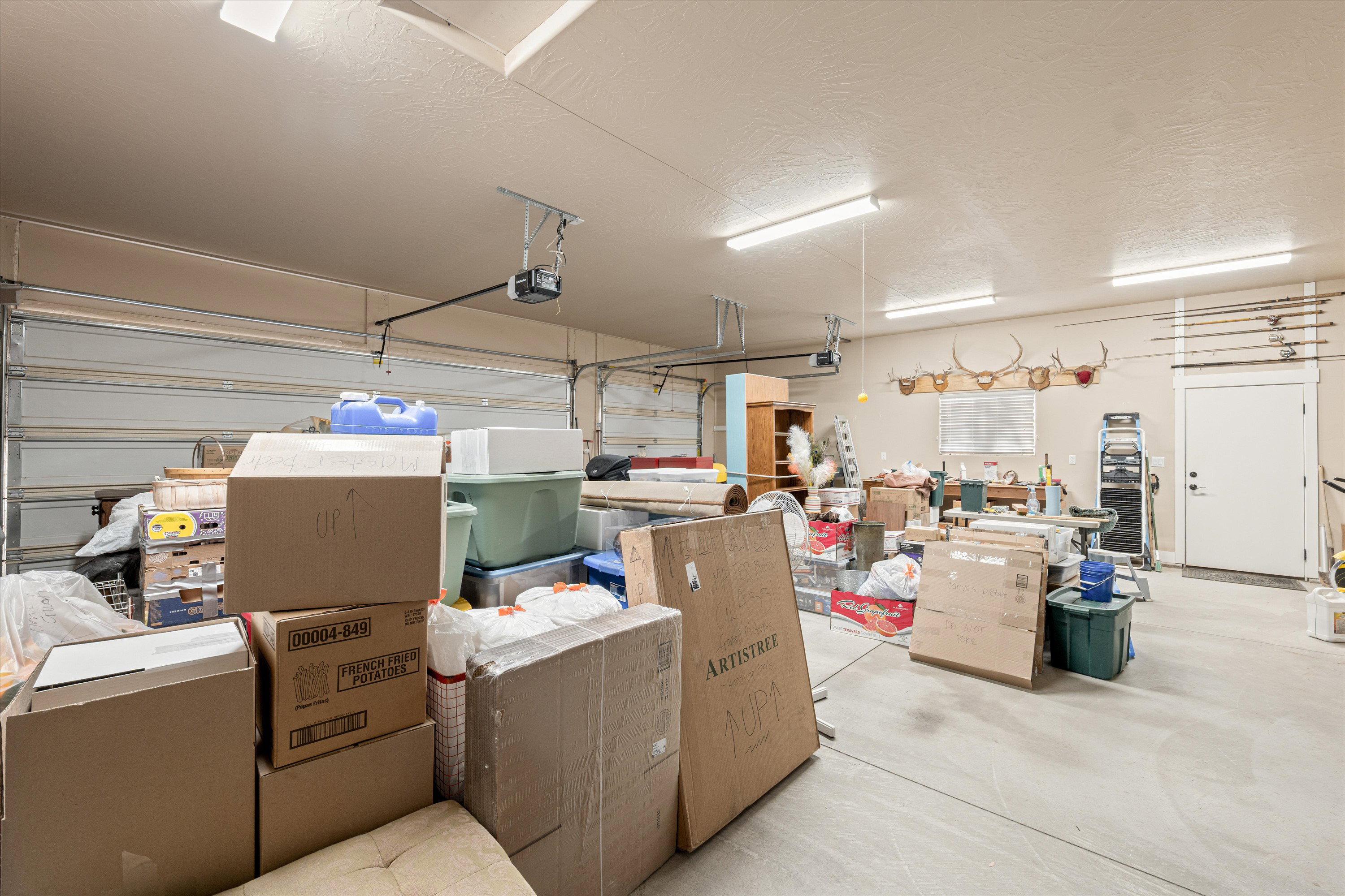 Garage featuring a garage door opener