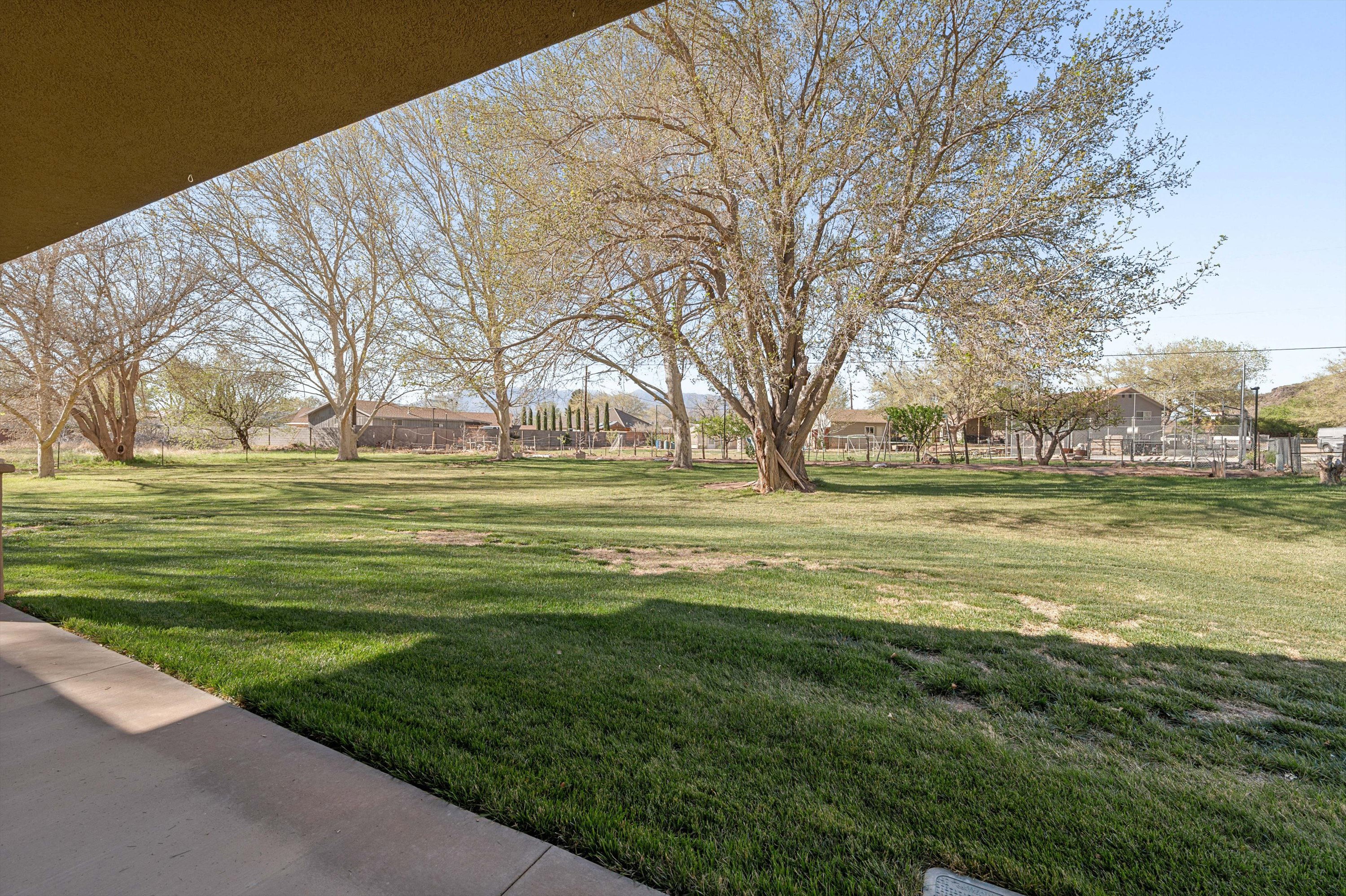 View of green lawn featuring a residential view