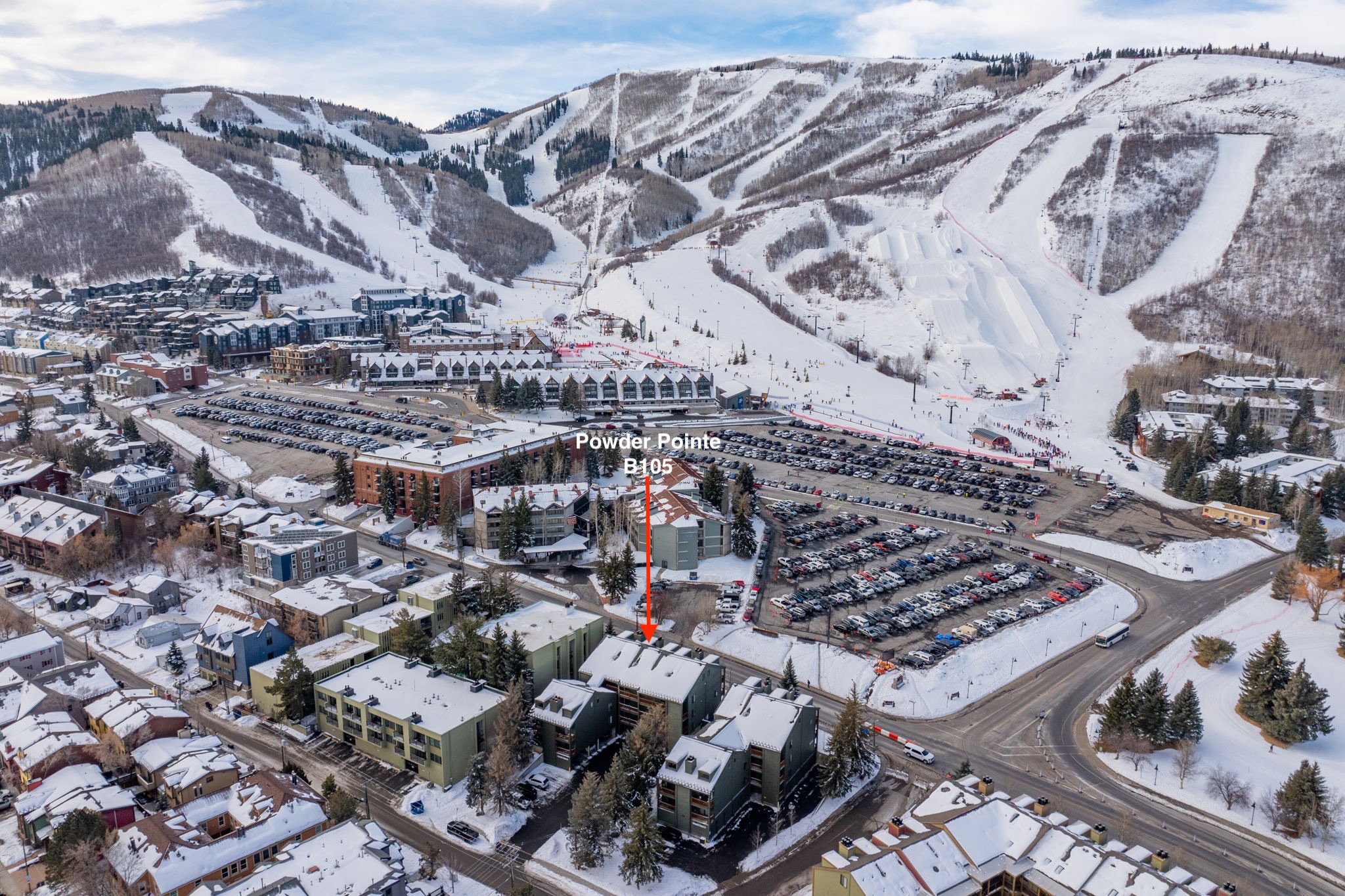 Snowy aerial view featuring a mountain view