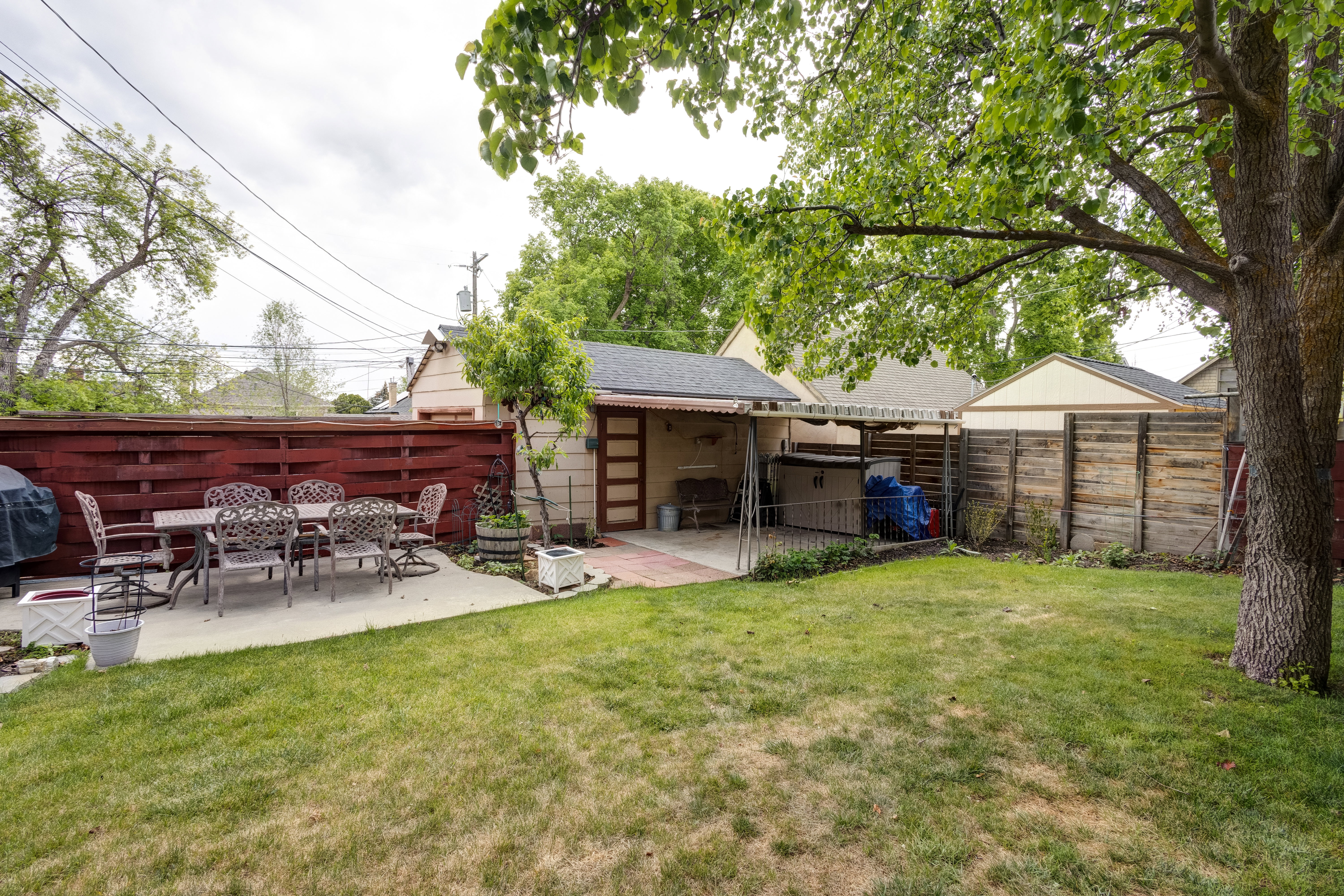 Fenced backyard with 2 patios. Covered and uncovered.