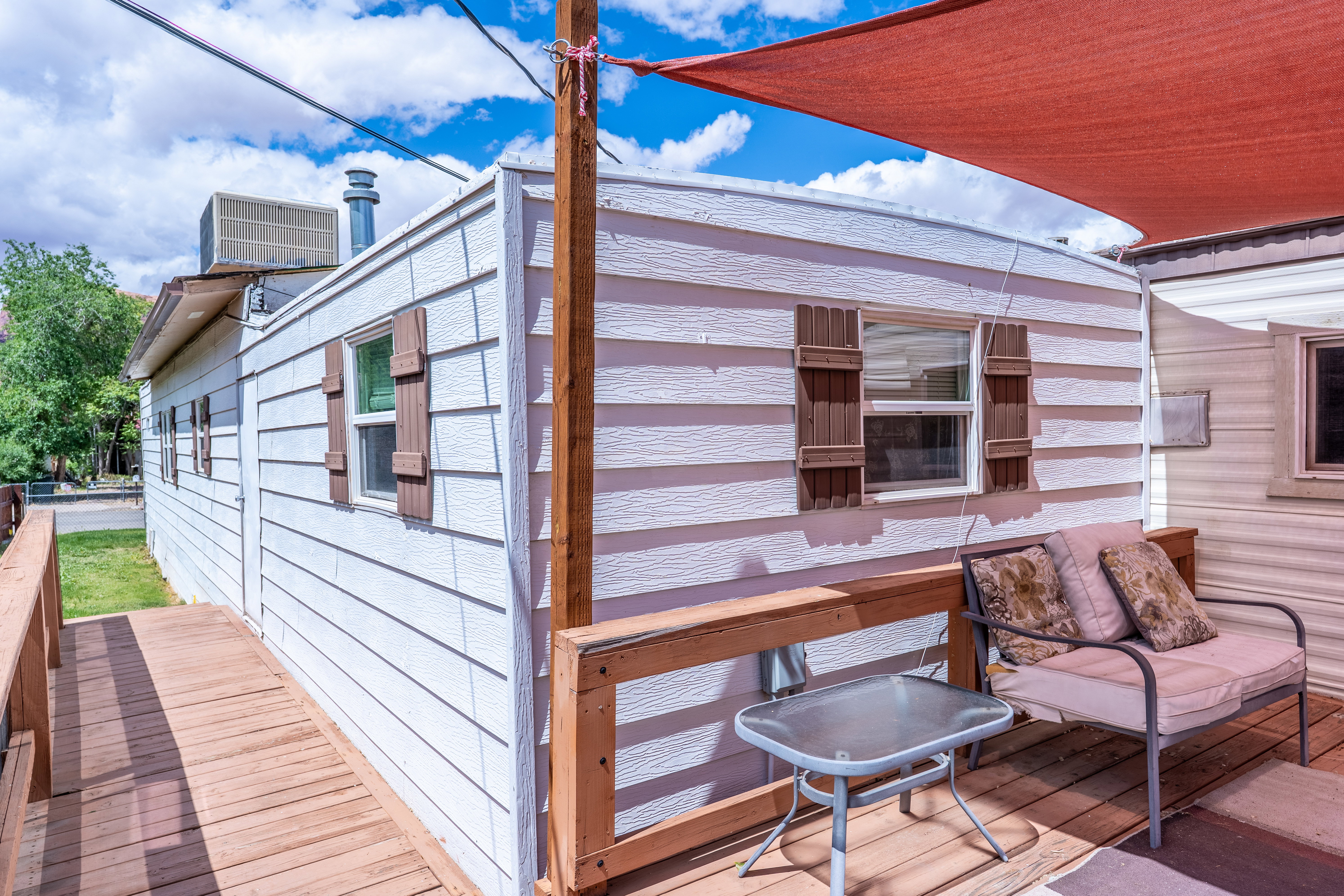 Wooden deck with a wall unit AC