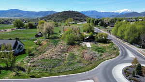 View of mountain background featuring rural landscape