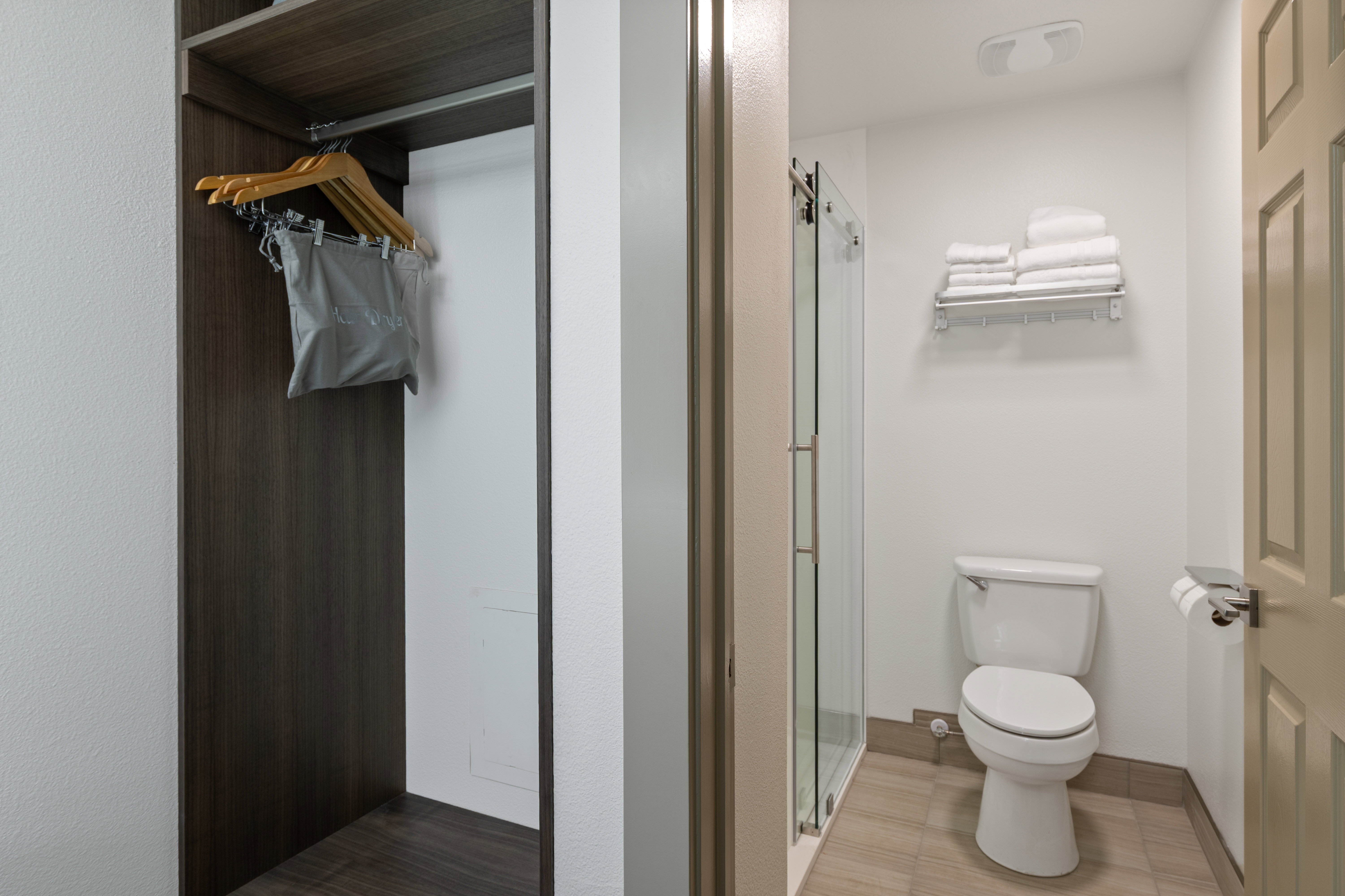 Full bathroom with toilet and a stall shower