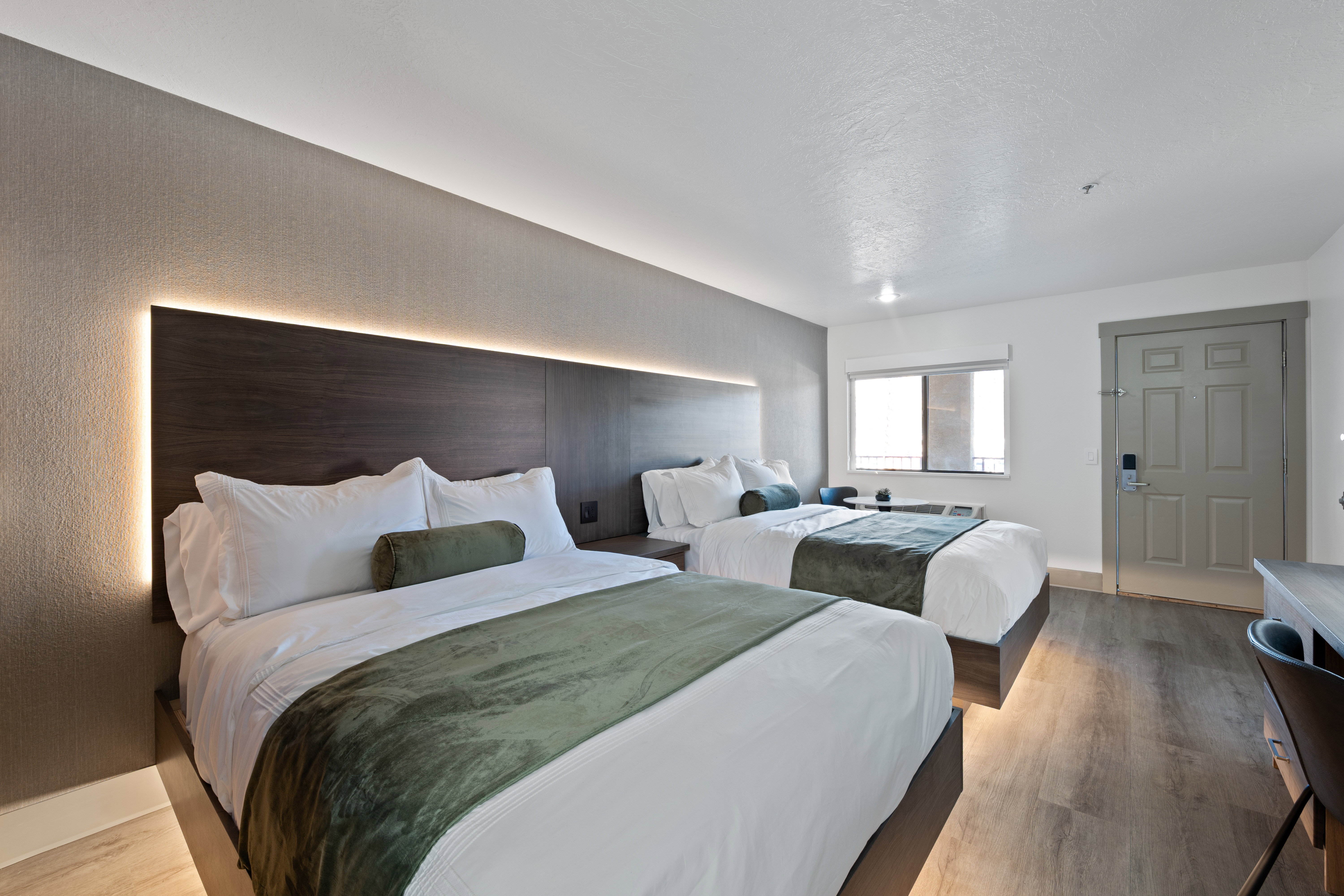 Bedroom with light wood-style floors and baseboards