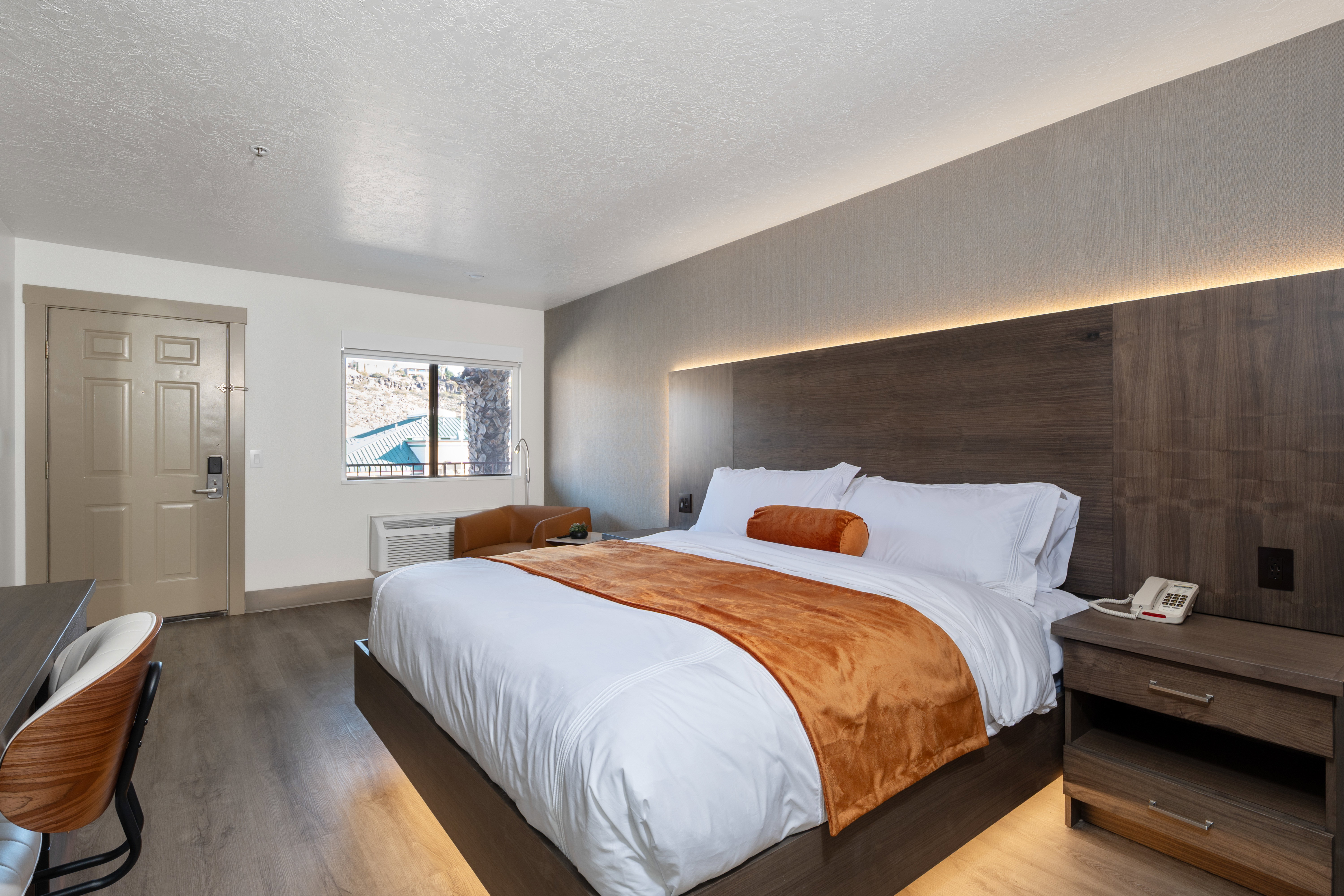 Bedroom featuring light wood finished floors and a textured ceiling