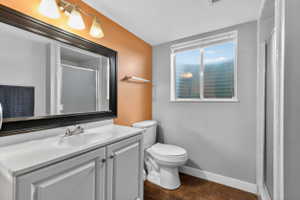 Full bathroom with a stall shower and NEW vanity