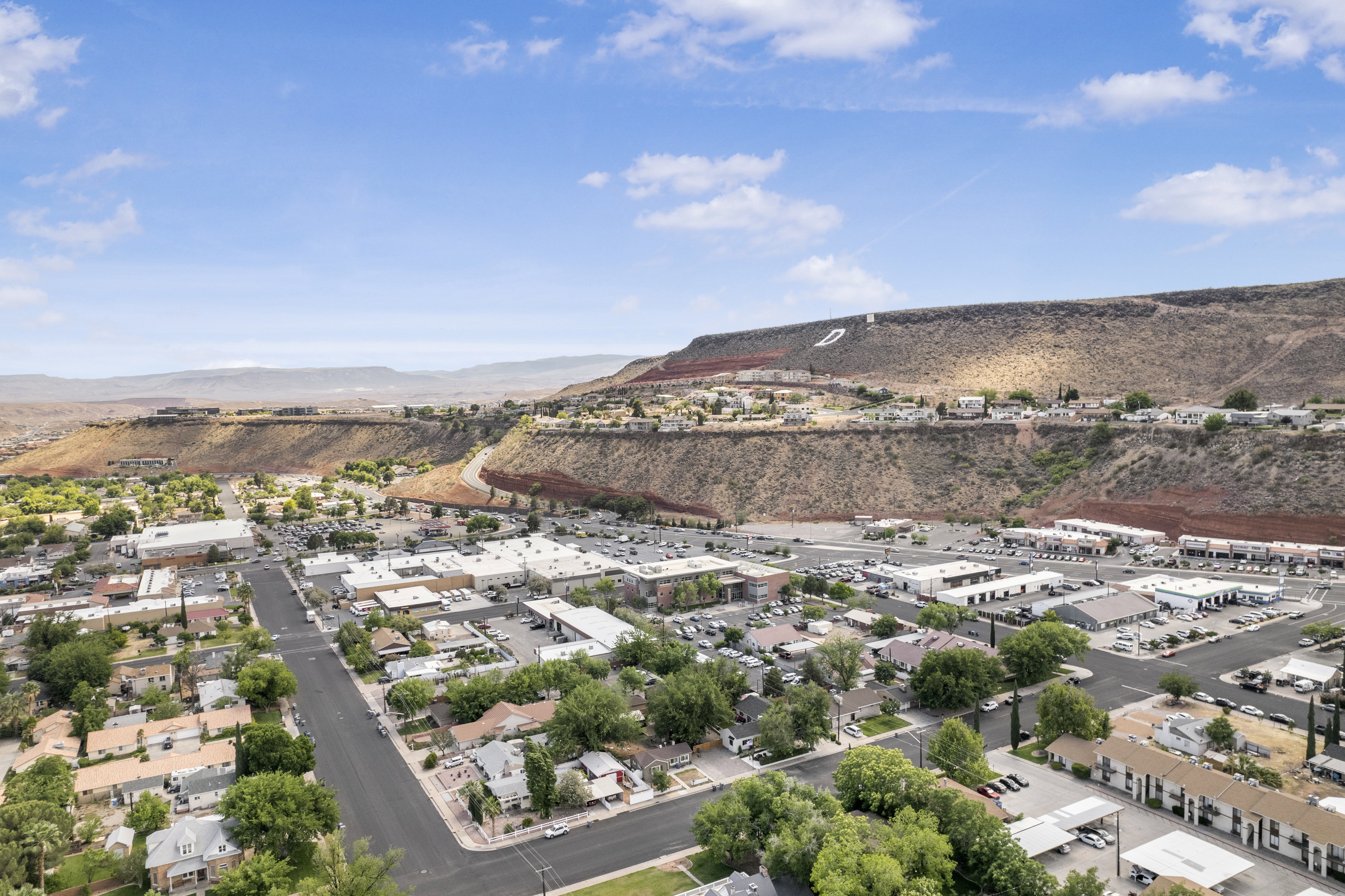 Aerial view of residential area featuring a mountain backdrop